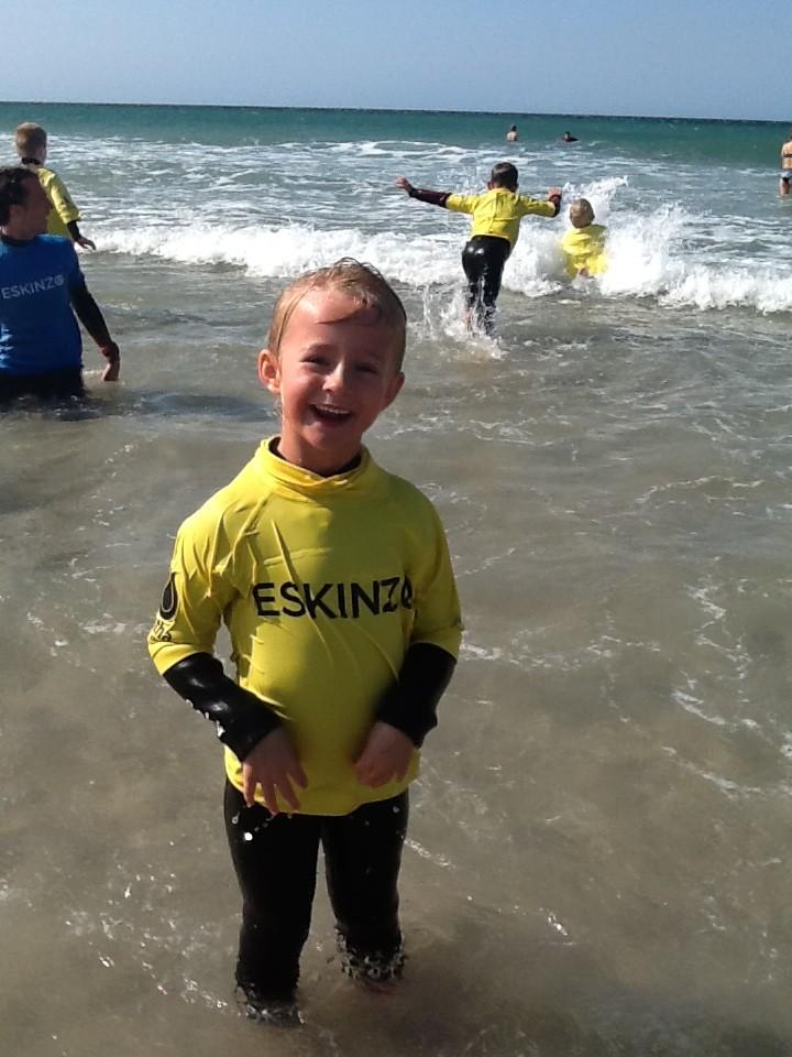 Children in the waves at the beach